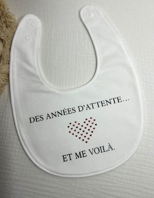 Bavoir « Des années d'attente... et me voilà »